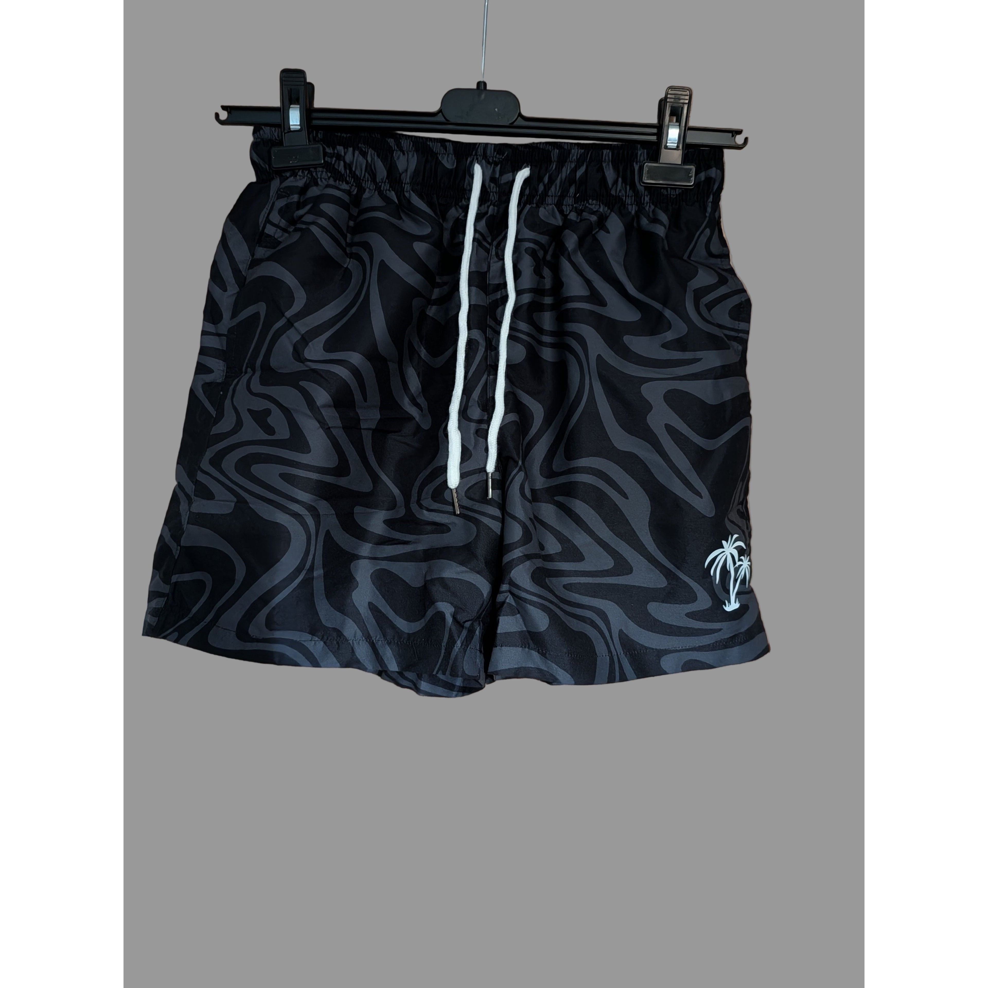 Black patterned shorts with a white drawstring