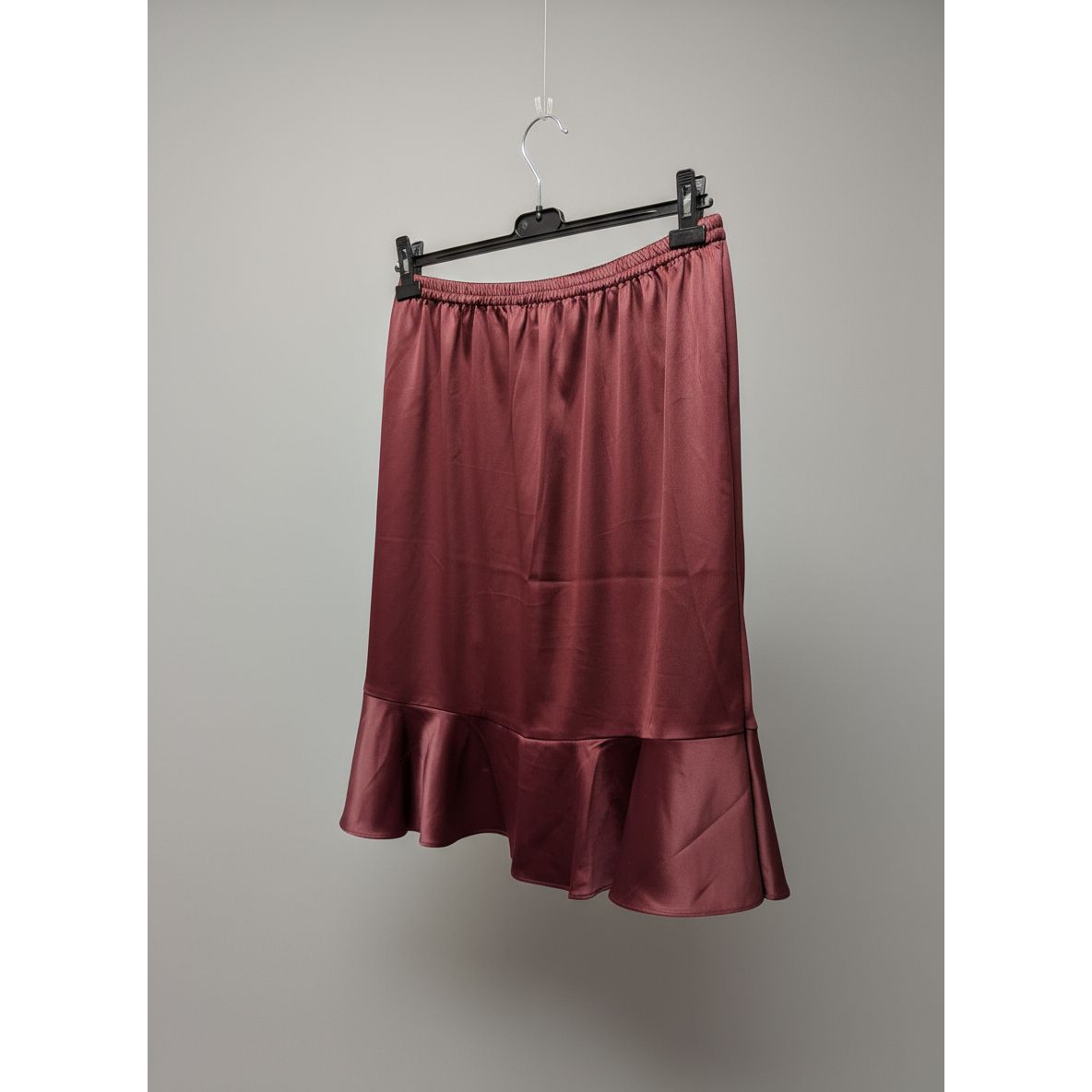 Red skirt hanging on a kitchen stove
