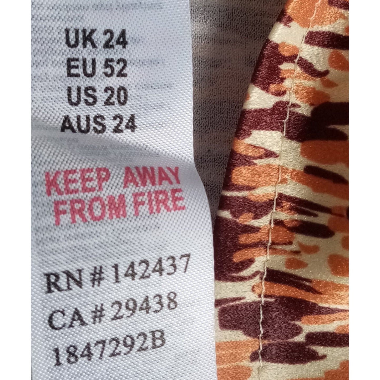 Text label on fabric with size and care instructions