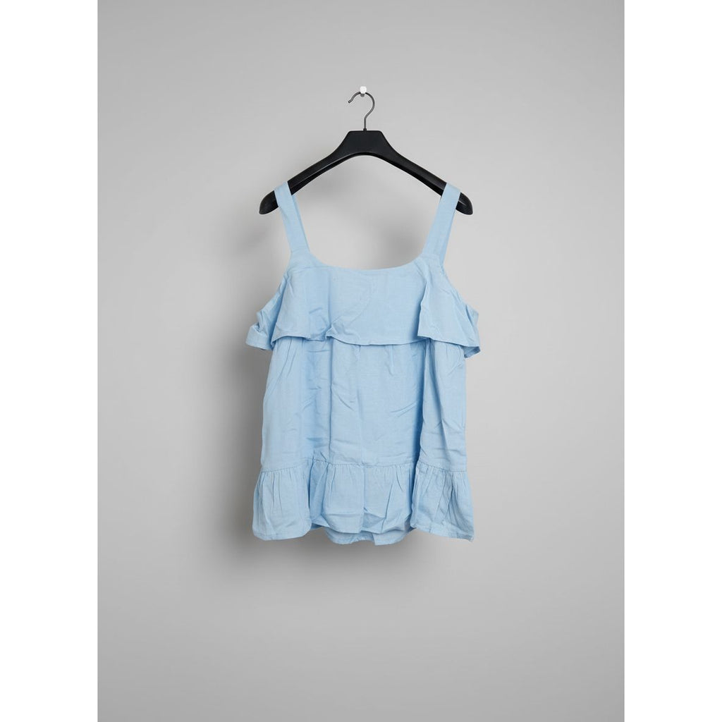 Blue top on a black hanger 