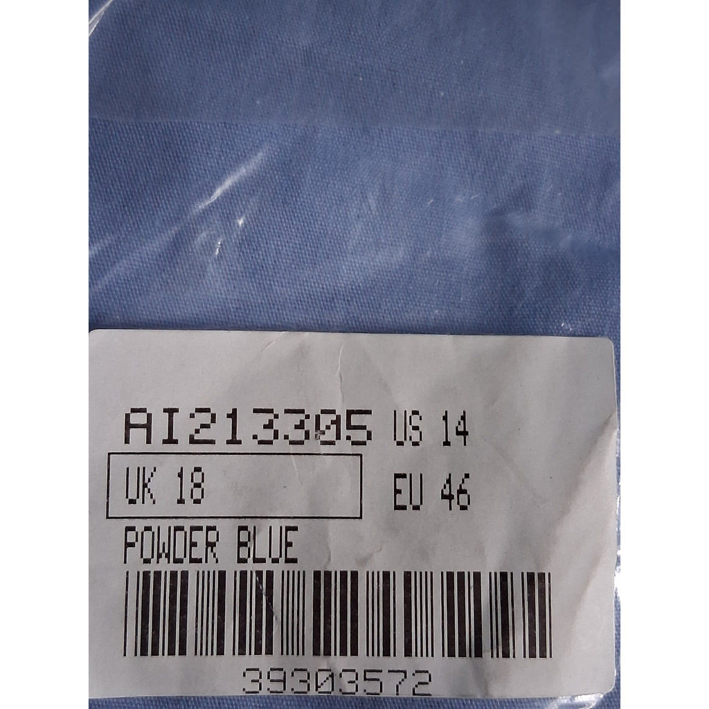 Clothing label with size and code information on a blue fabric background