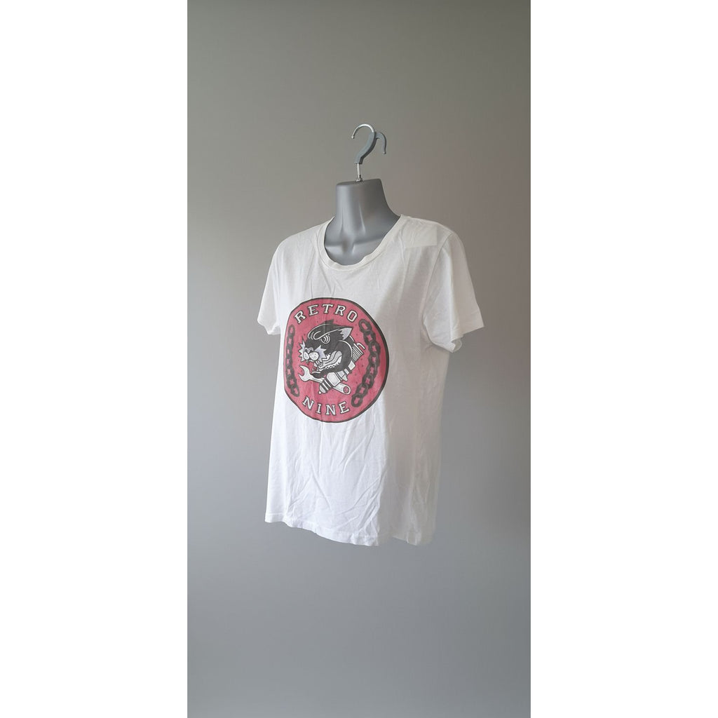 White tank top with a red logo on a tiled floor