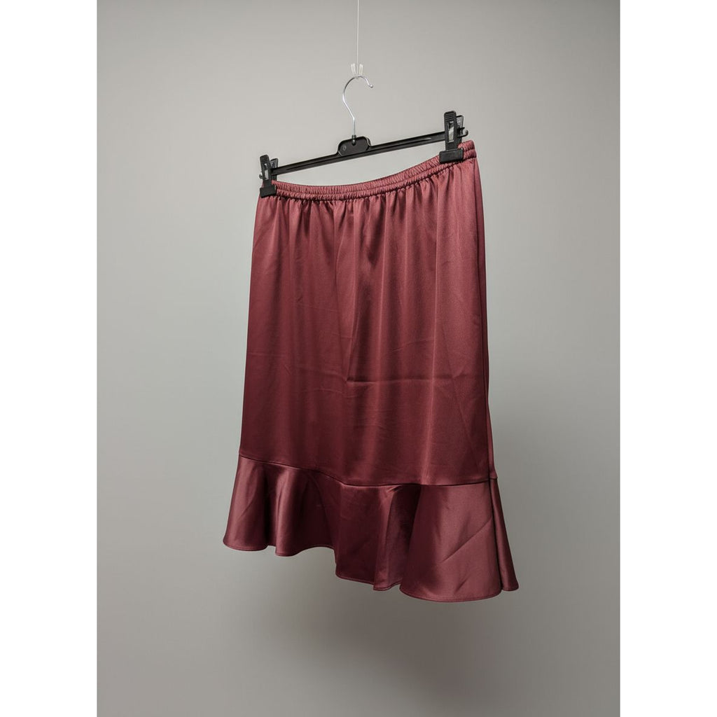 Red skirt hanging on a kitchen stove