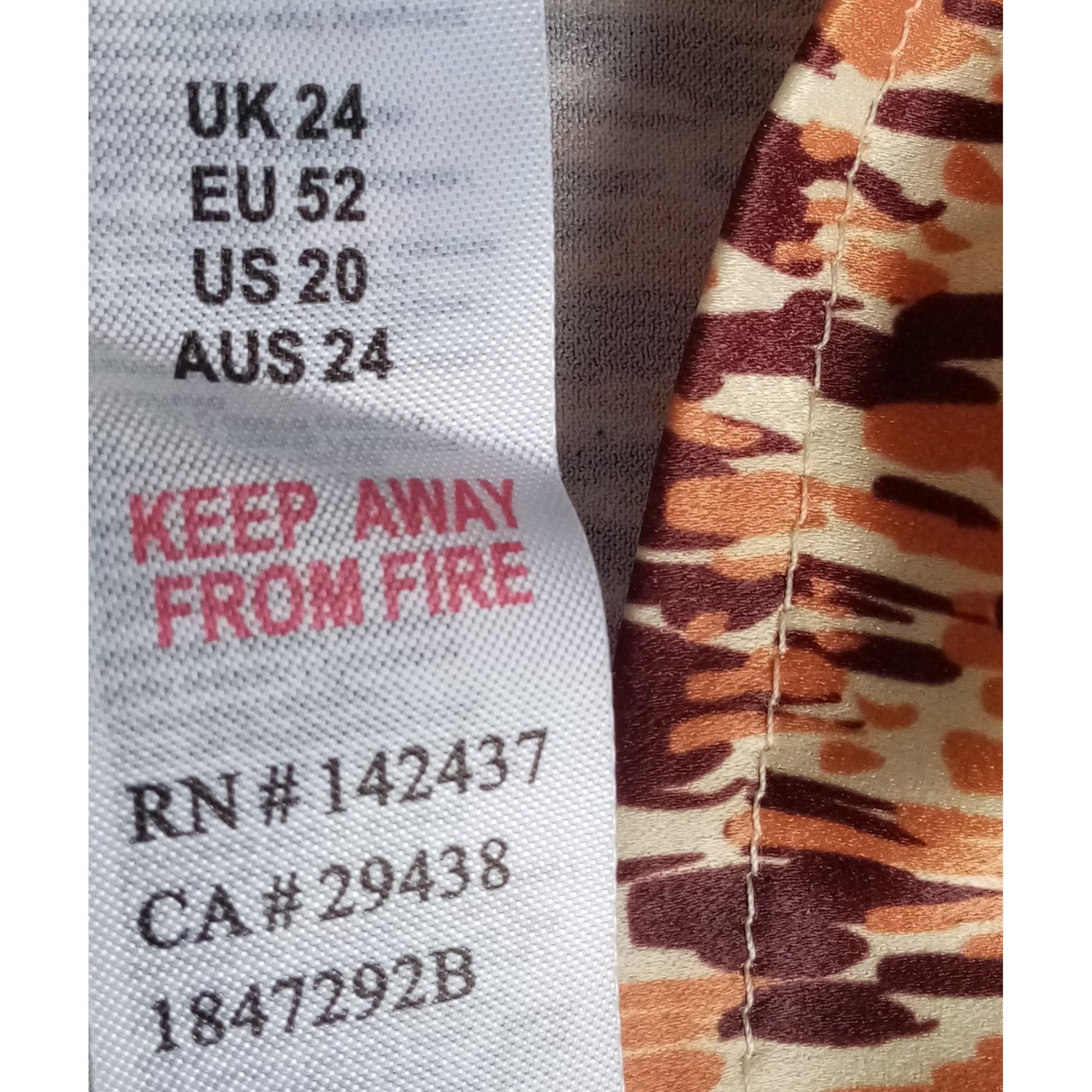 Text label on fabric with size and care instructions