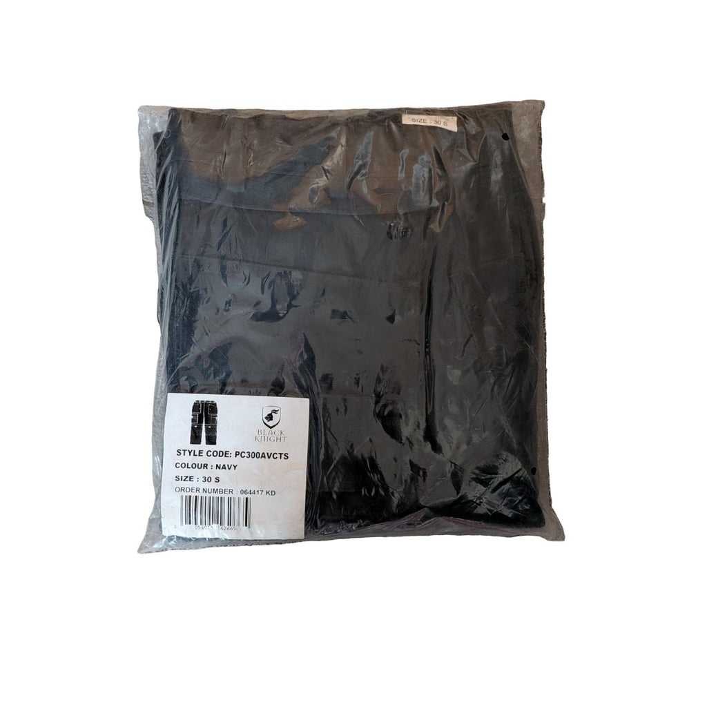 Packaged black jacket with a label on a gray surface