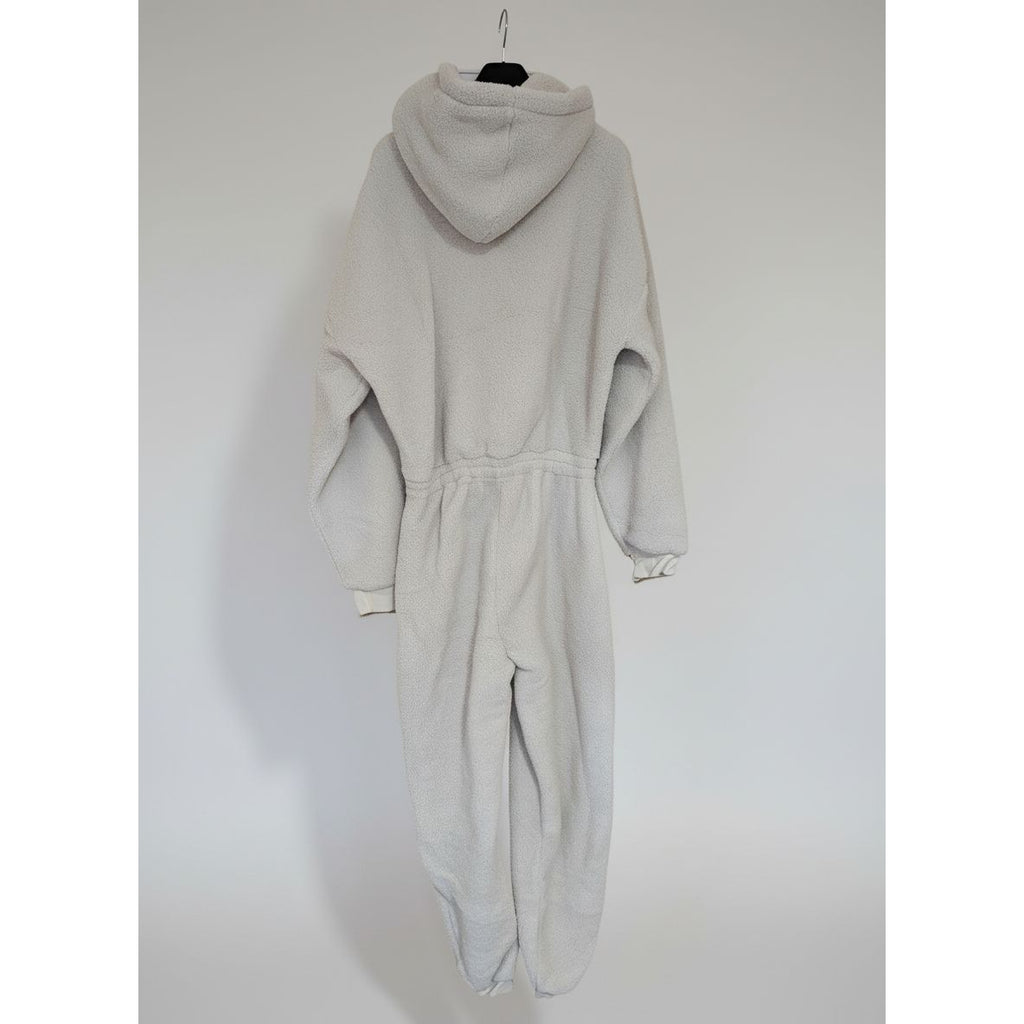 Light gray onesie with a hood on a dark background