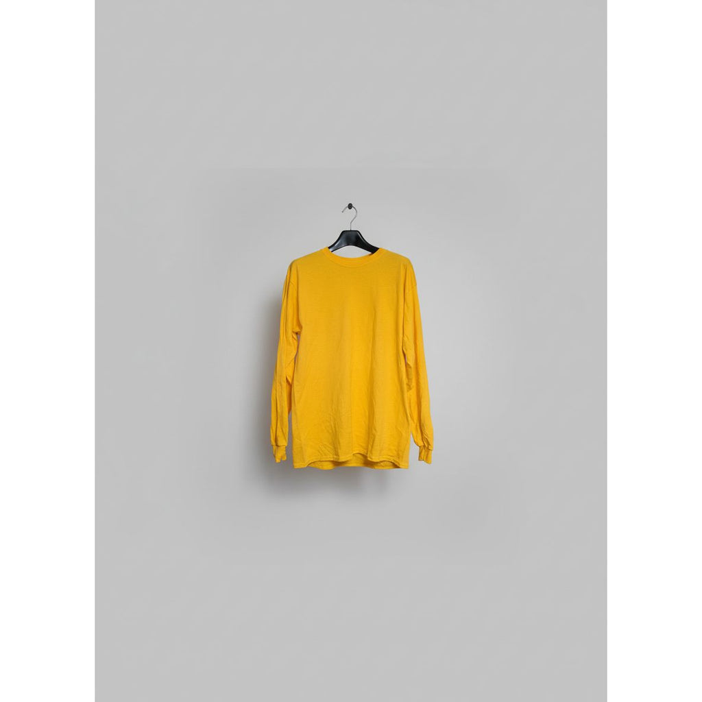 Yellow long-sleeve shirt on a hanger 