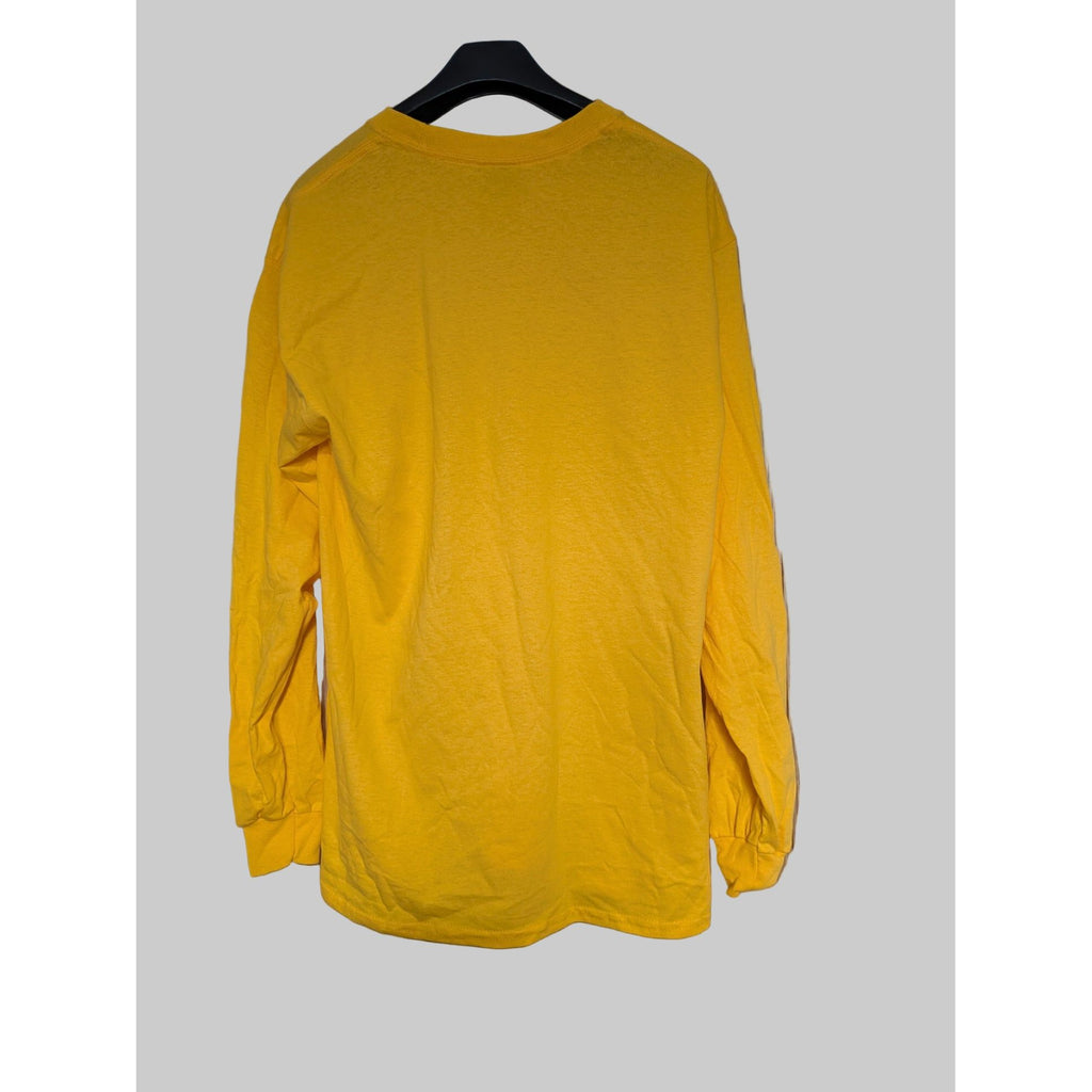 Yellow long-sleeve shirt on a hanger 