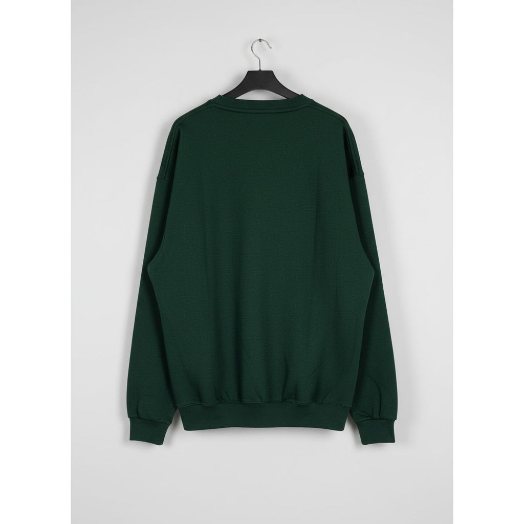 Green sweatshirt on a hanger 