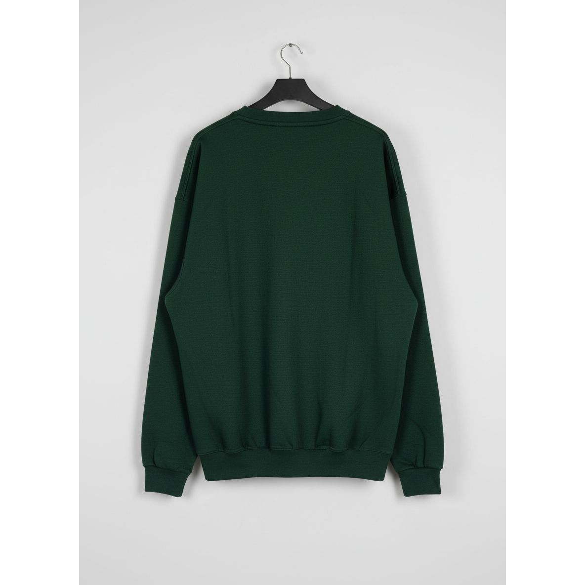 Green sweatshirt on a hanger 