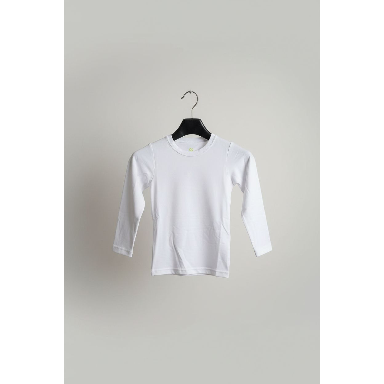 White long-sleeve shirt on a hanger