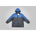 Blue and gray raincoat with a tag on a grassy background