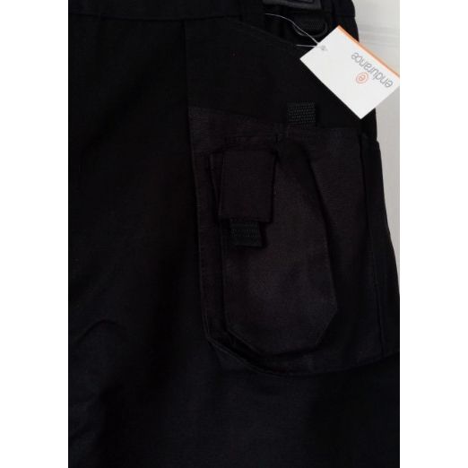 Black pants with a brand tag on a grey background