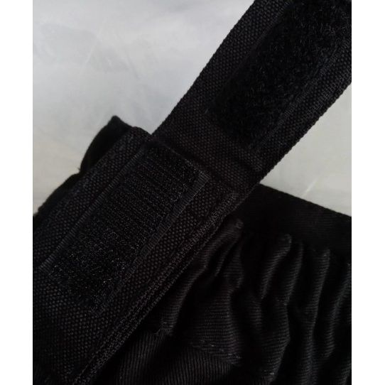 Close-up of a black belt with a textured surface on a white background
