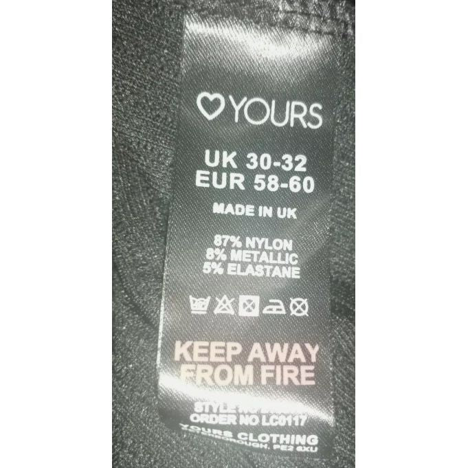 Fabric label with size information and care instructions on a textured background