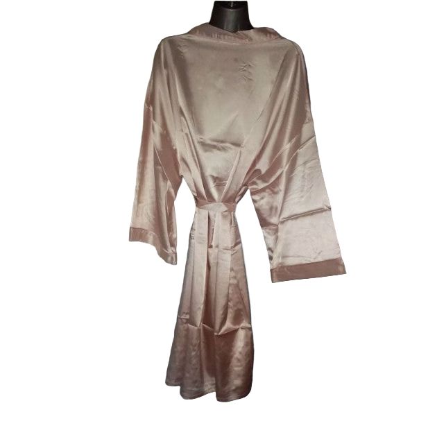 Pink satin robe on a mannequin against a neutral wall.
